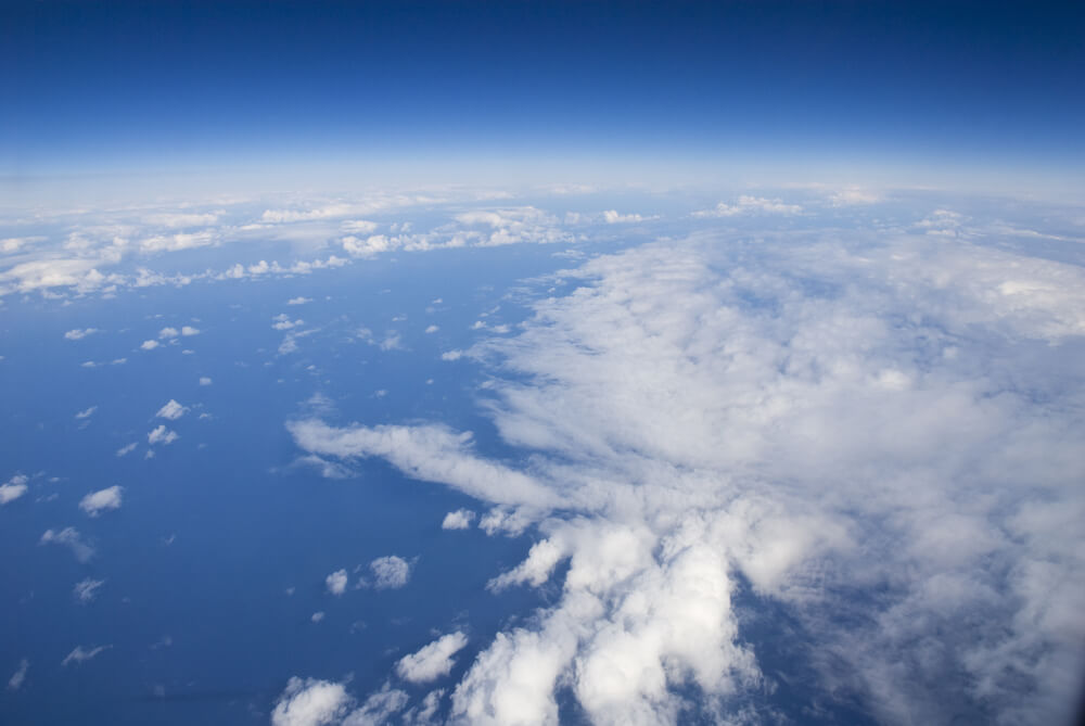 Wispy clouds in a deep blue sky.